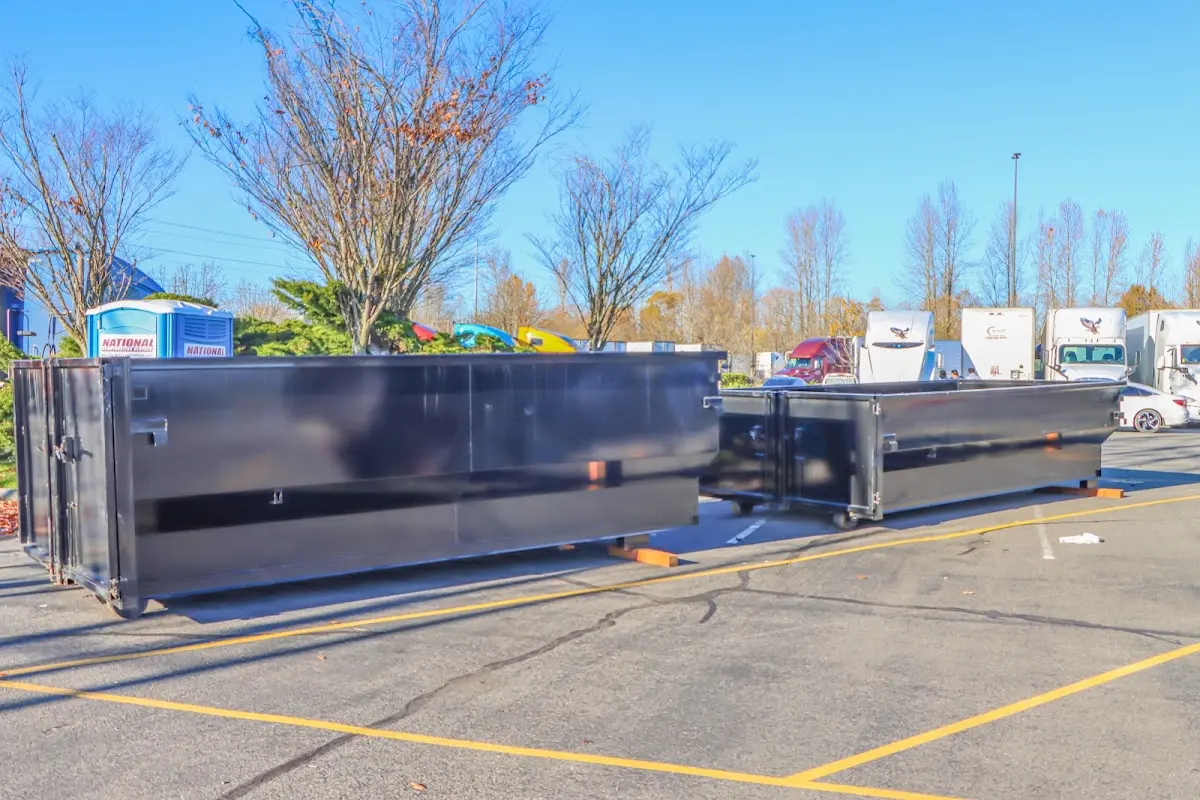 Professional dumpster rental service with roll-off container on residential driveway in Rowland Heights